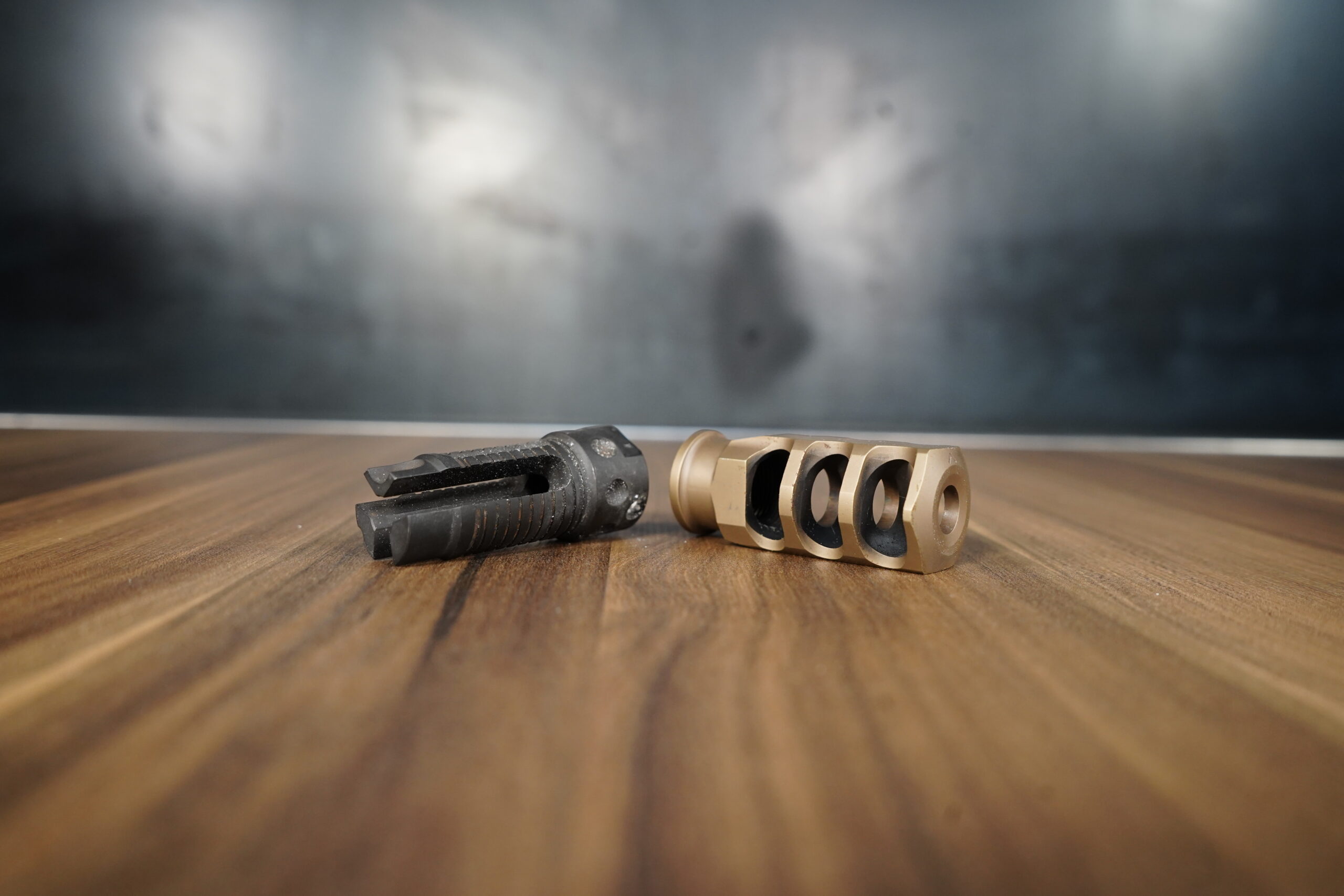 A photo of a flash hider and a muzzle brake