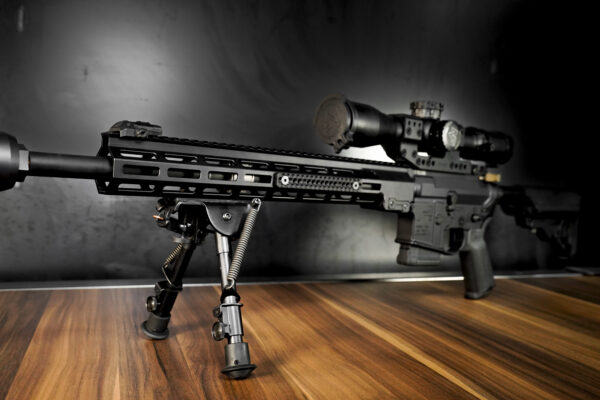 black long rail cover on rifle with scope